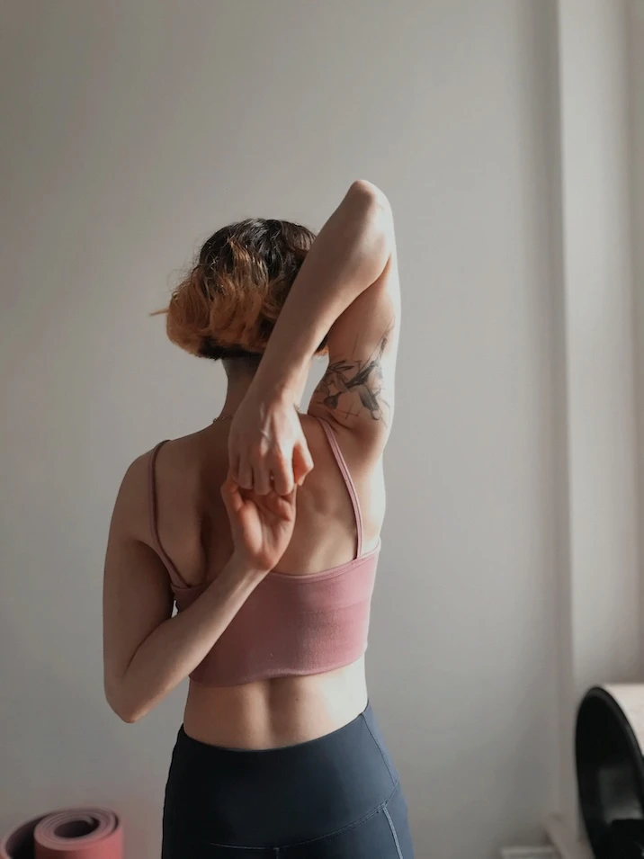 Necla binding her hands behind her back